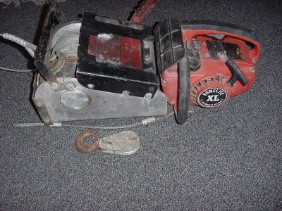   POWERED PORTABLE CHAINSAW WINCH + HOMELITE CHAIN SAW LEWIS RULE  